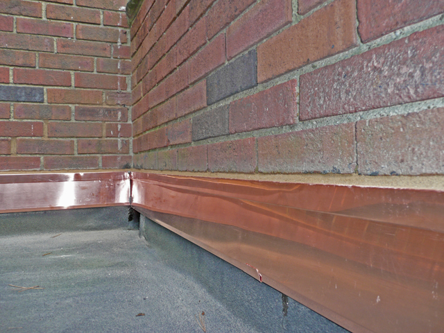 New copper counter flashing on flat roof